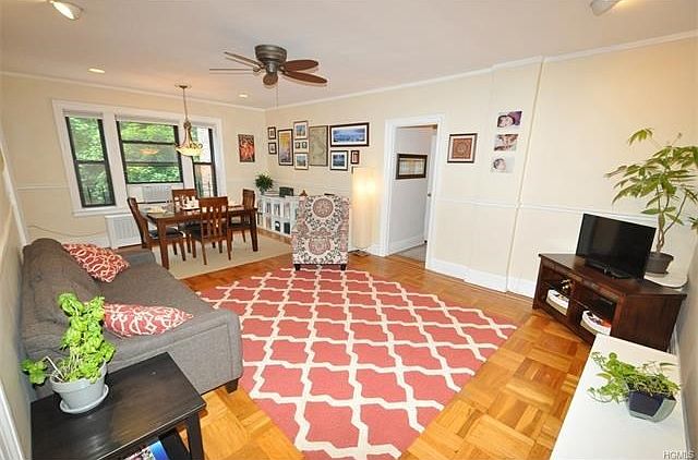 Large Living Room overlooking Garth Woods and the buildings patio.  The living room has recess lighting, chair rail and refinished parquet floors.  The room is 23'-0" x 14'-0".