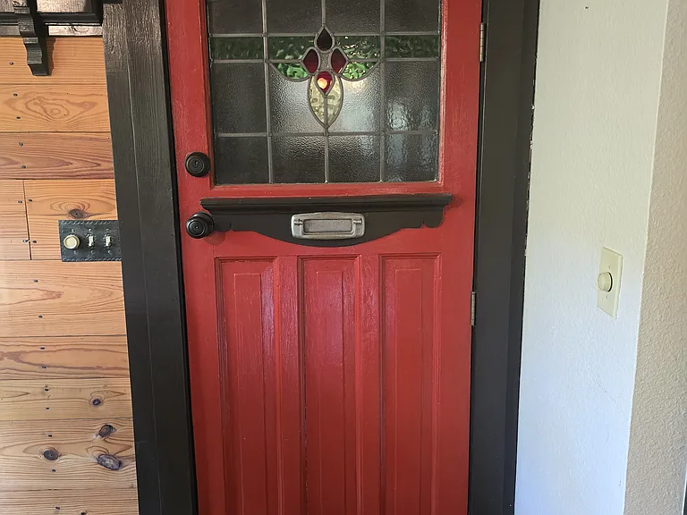 Whimsical touches throughout - door to 1/2 bath on main level.
