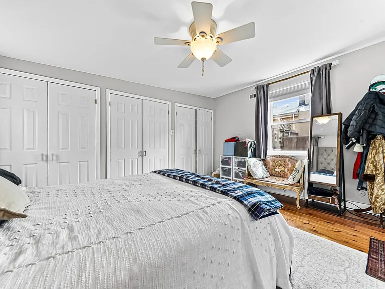 bedroom with wall of closets