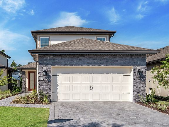 Two-story home by LGI Homes with stunning upgrades included