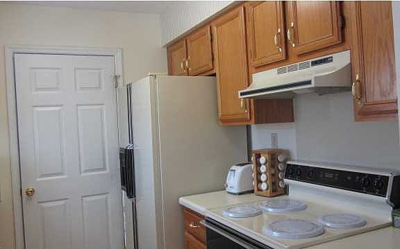 Kitchen with appliances and oak cabinets