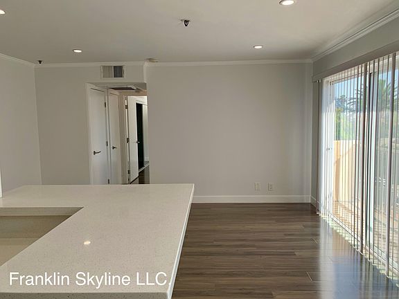 Kitchen looking towards living area and bedroom hallway