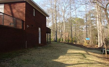 Large wooded lot : Basement door with concrete floors, tons of storage, open crawl space