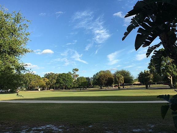 Panoramic vista from yard over two fairways, 1/4 mile unobs