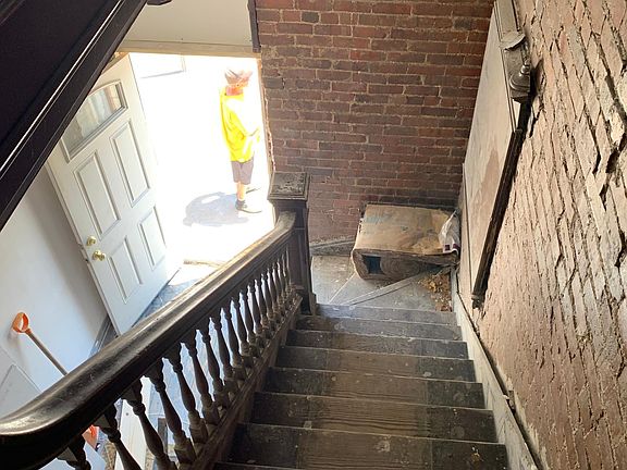 Stair Case leading to Main Front Entry (picture showing construction in progress)