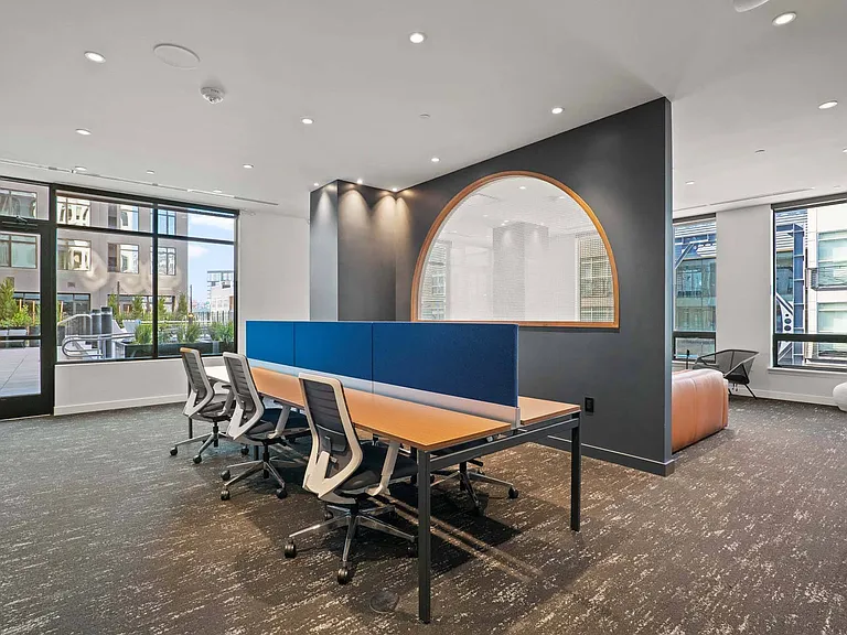 Settle into a modern workspace, designed for focus and productivity with sleek, functional furnishings.
