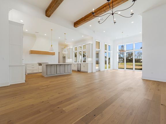 Open Living Kitchen -- natural light, exposed beams, and designer lighting