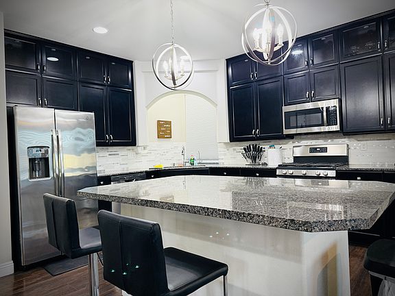 The bar overlooks the kitchen & living room.