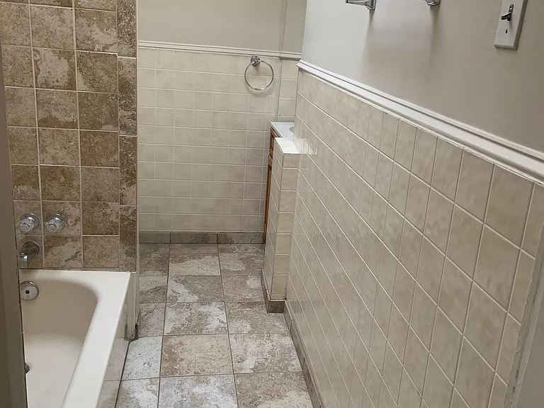 1st Bathroom on the left as you enter the apartment