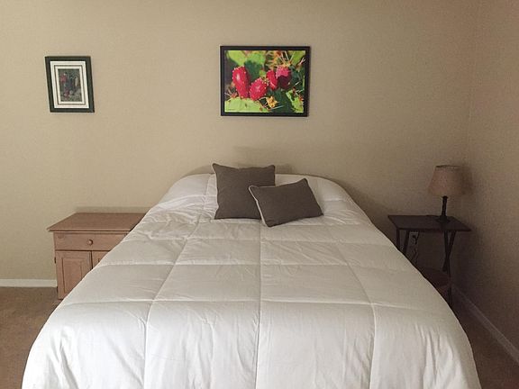 MBR with queen-sized bed and walk-in closet