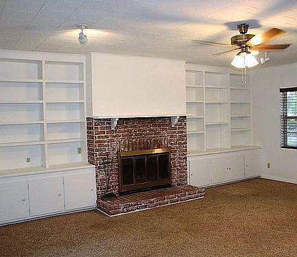 Den w/fireplace & shelving 