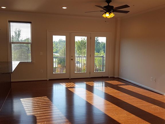 Family Room + Dining Room with Balcony/Deck - Opens to beautiful view and open space outside