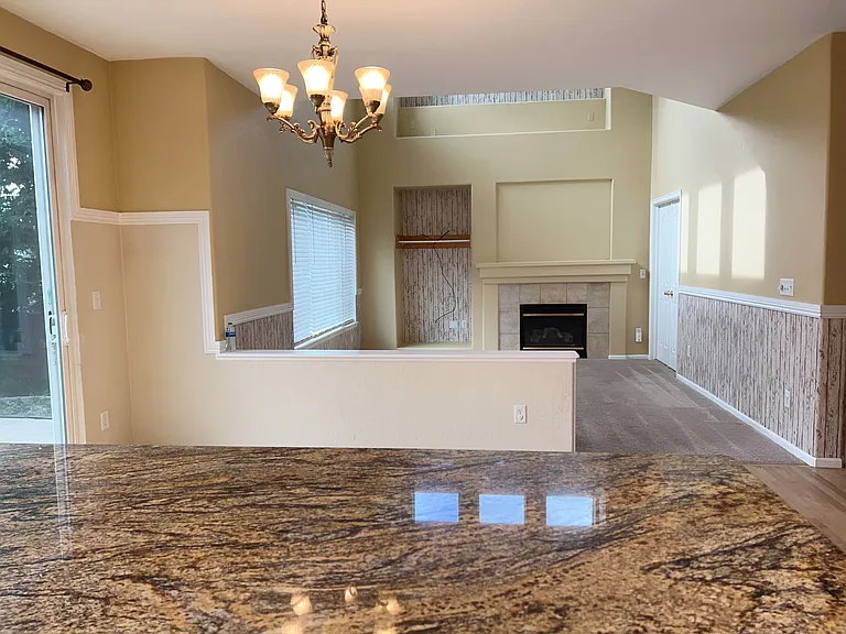 View of the dining area and the family room from the Kitchen countertop