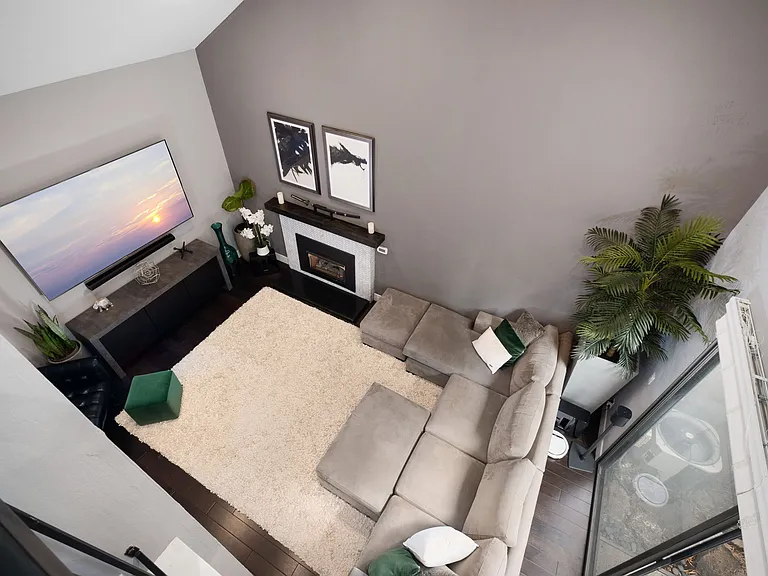Livingroom overview huge couch to lounge out on after a long day.