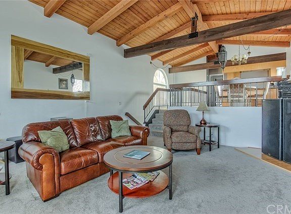 Living room with beamed ceiling