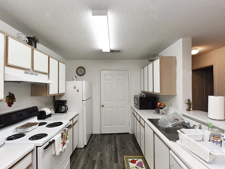 Spacious kitchen with appliances and breakfast bar