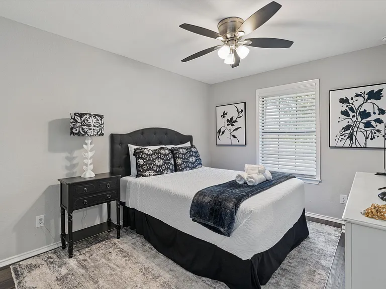 Secondary Bedroom Queen Plush Bed Full sized Dresser with Mirror and large closet