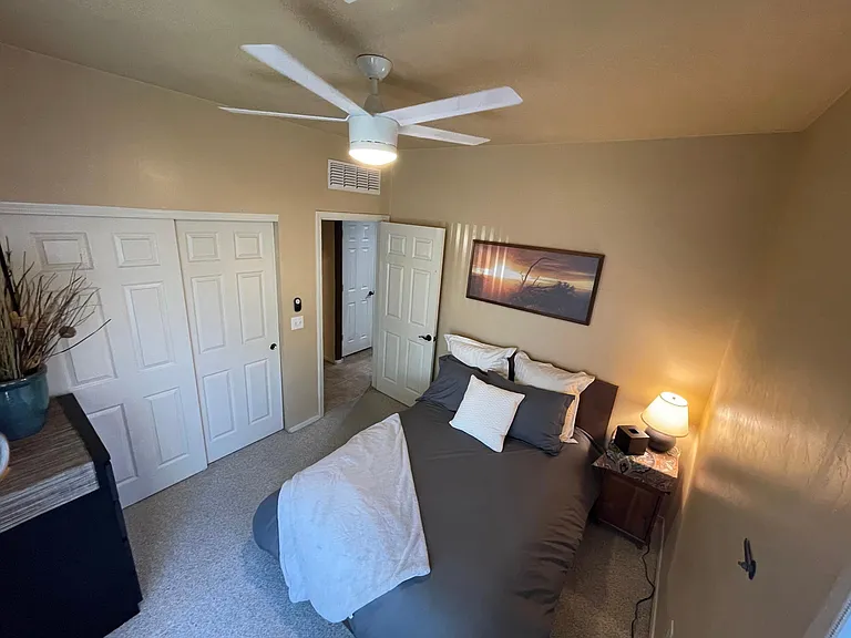 Bedroom 2 going into the hallway 

Ceiling fan in room