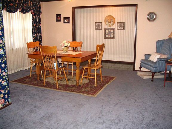 The living area is wide open to the dining area just off the kitchen