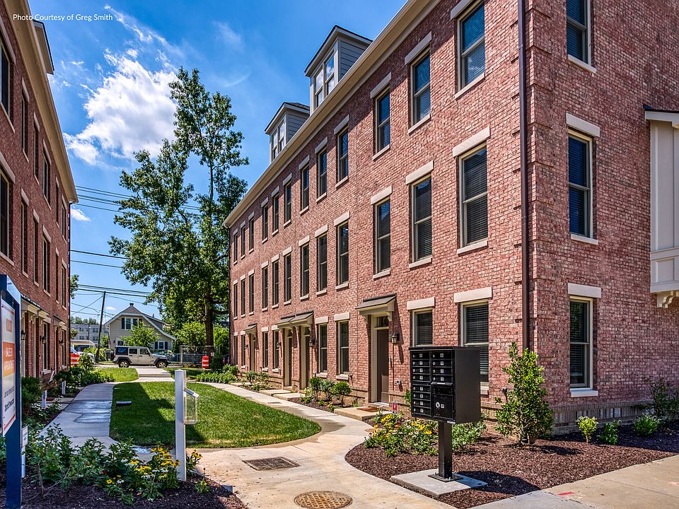 Distinguished red-brick facades create an attractive entrance.