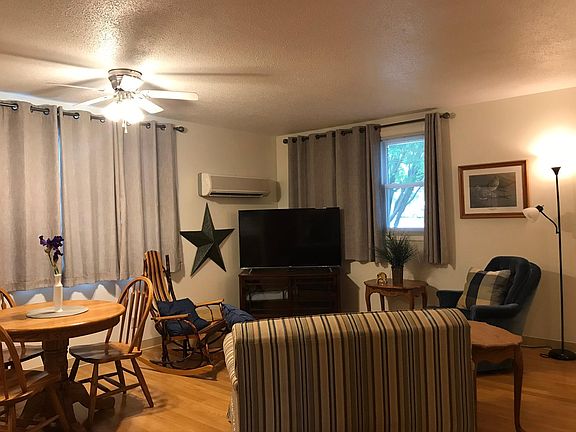 Living area with Smart TV, love seat with pull out twin bed