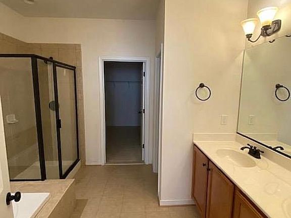 Large master bath leading to large walk in closet