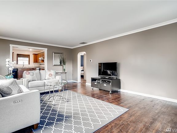 Period details like the arched doorways add old world charm to this classic Tudor. 