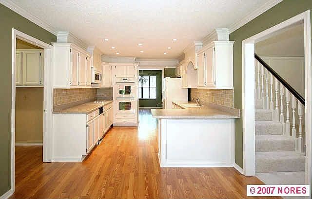 New Kitchen with Corian Counters & Tile Backsplash