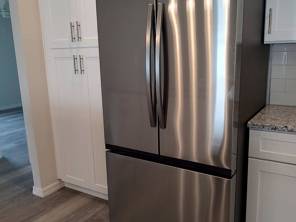 Kitchen with Brand New Stainless Appliances, brand new cabinets, and granite counters.