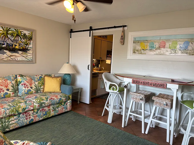 Living room with surfboard dining table.