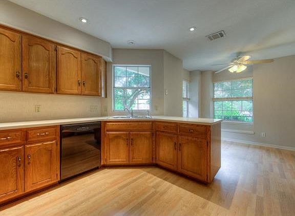 Spacious and bright eat in kitchen.  Ample counter space, updated diswasher, wall oven and sink.
