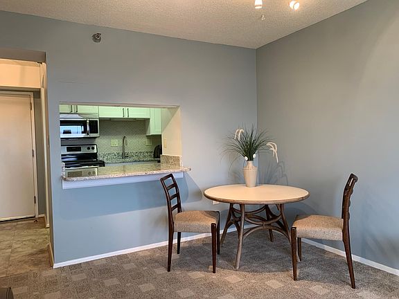 dining area with pass through kitchen bar