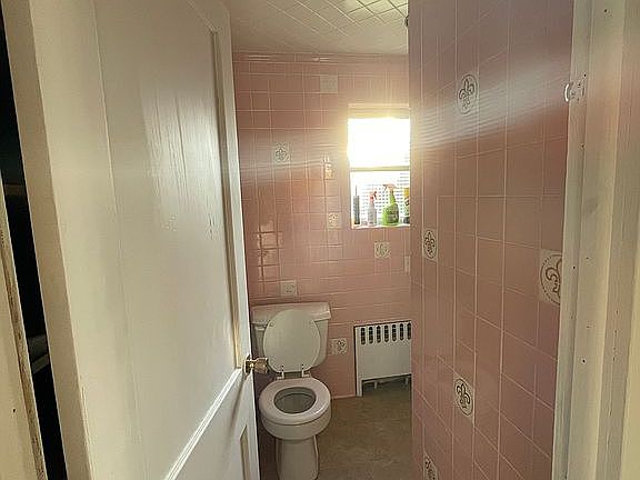 Full bath with original tile