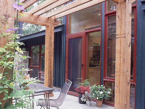 Patio with pergola off of kitchen.