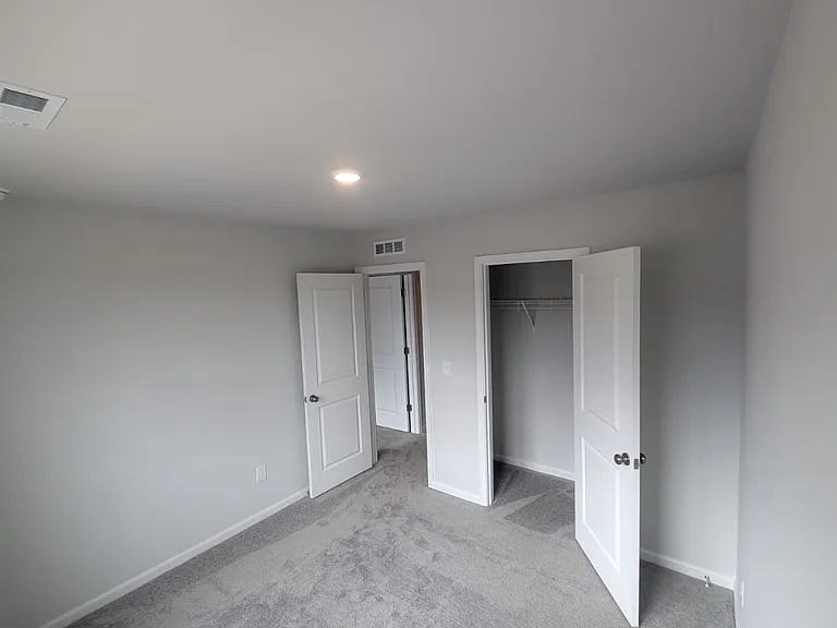 Interval view of one of the other bedrooms on the third floor