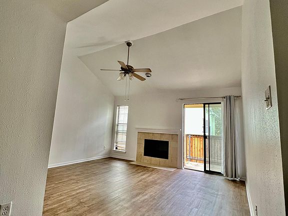 Living Room with ample natural lighting and vinyl flooring through the entire unit that provides easy cleanup and feels like wood.