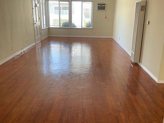 spacious living room entrance door #1
