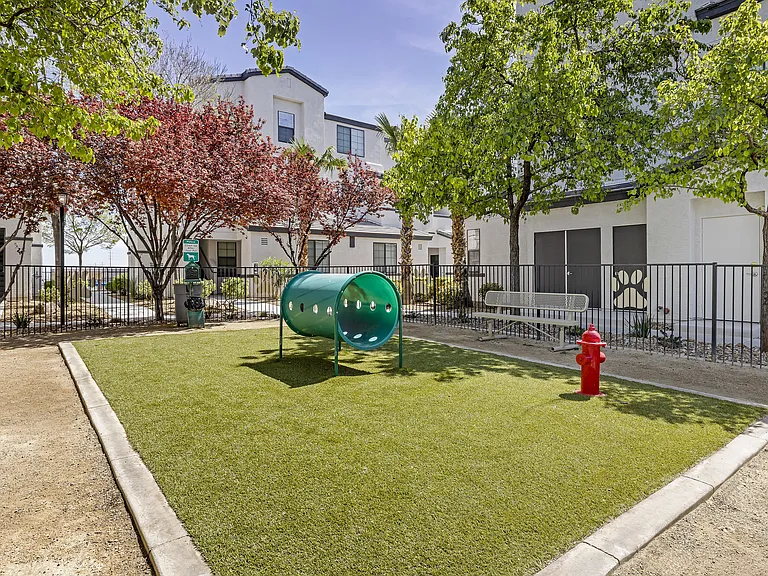 Unleash the ultimate in pet-friendly luxury at The Michael B! Our gated dog park offers a serene retreat with shaded trees and a cozy bench for you and your furry friend to relax and enjoy the day.