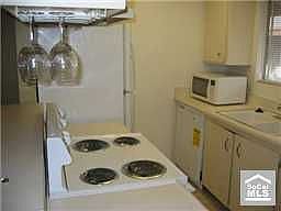 Kitchen with brand new stove and dishwasher