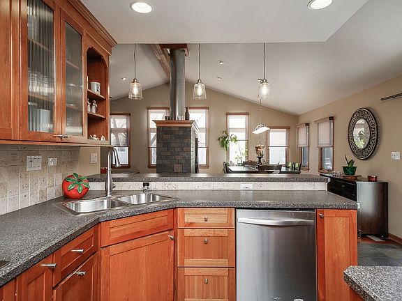Travertine backsplash, stainless steel appliances.
