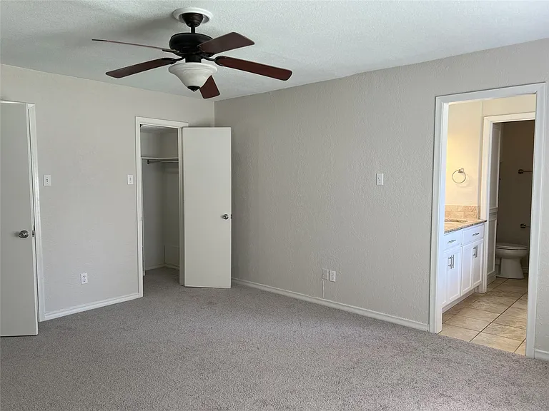 Primary first floor bedroom with two closets and ensuite bath