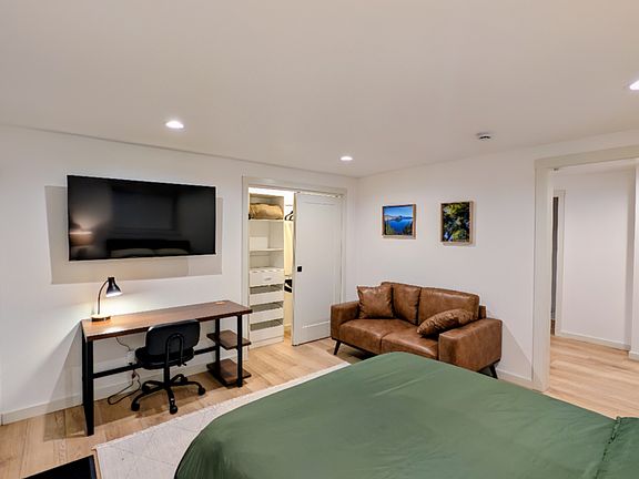 Additional items are a smart TV and a closet wardrobe system.