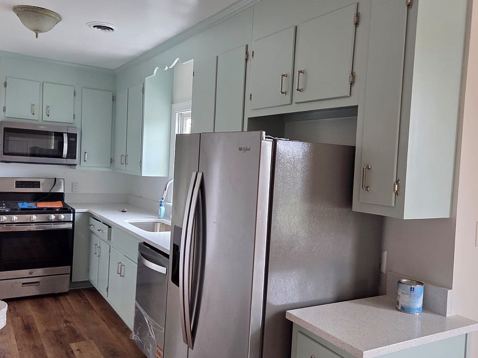 Newly renovated kitchen with new countertop and appliances.