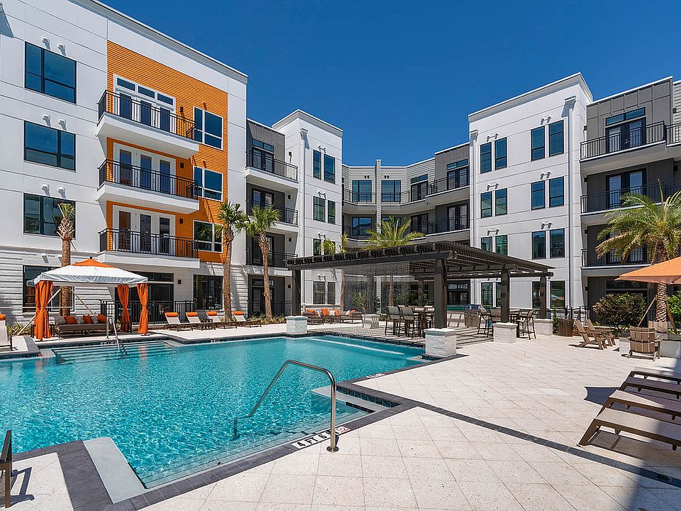 Enjoy the sun by the pool in this luxurious apartment community.