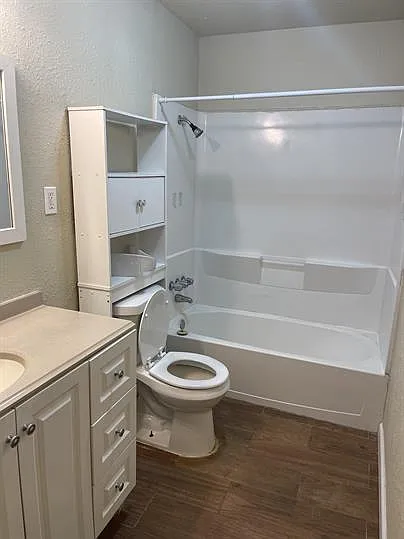 Full size tub/shower with updated vanity and linen closet