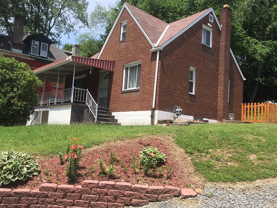Red Brick House with large covered front porch