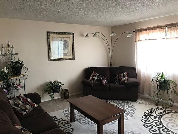 Main living room as soon as enter the house. Leads directly to small dining room with a beautiful kitchen to the right of the dining room.