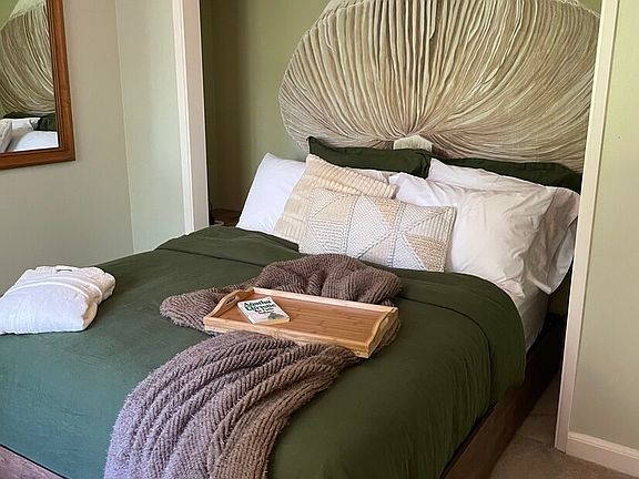 2nd bedroom with queen bed, hand painted art