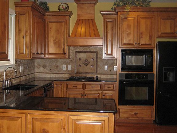 granite, custom cabinets, tile back splash, gas range, all new appliances