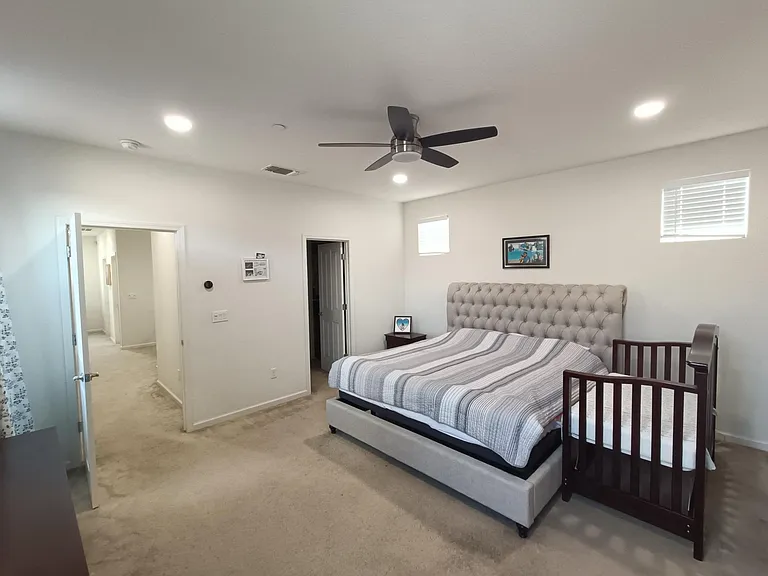 Indulge in the luxury of our spacious master bedroom _ a haven designed for comfort and relaxation. Expansive and elegantly appointed, this room is a retreat within your home. Welcome to a master bedroom where serenity meets style. ___